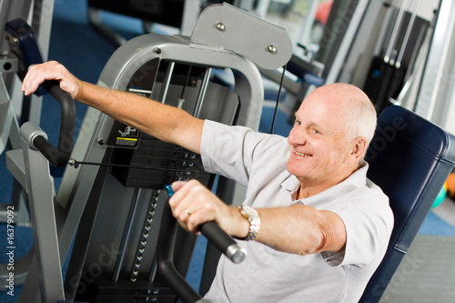 Older man exercising at the gym © jamstockfoto