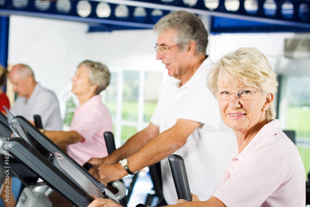Older people exercising in the gym Older people exercising in the gym