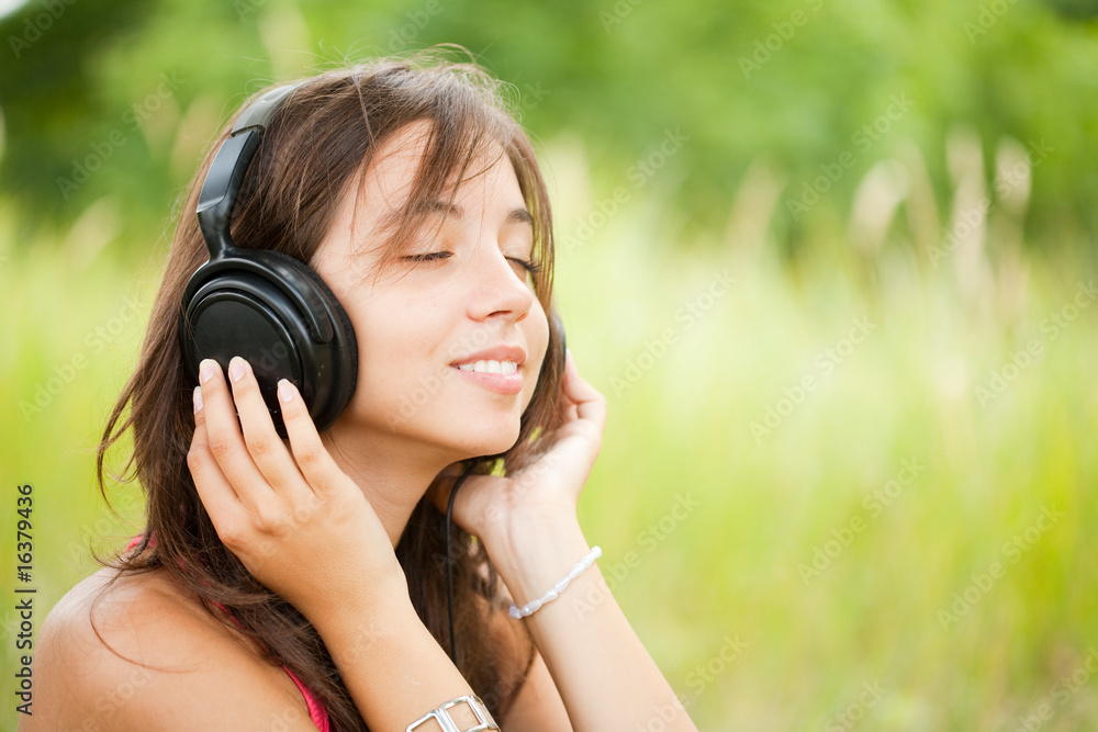Young woman with headphones outdoor Young woman with headphones outdoor