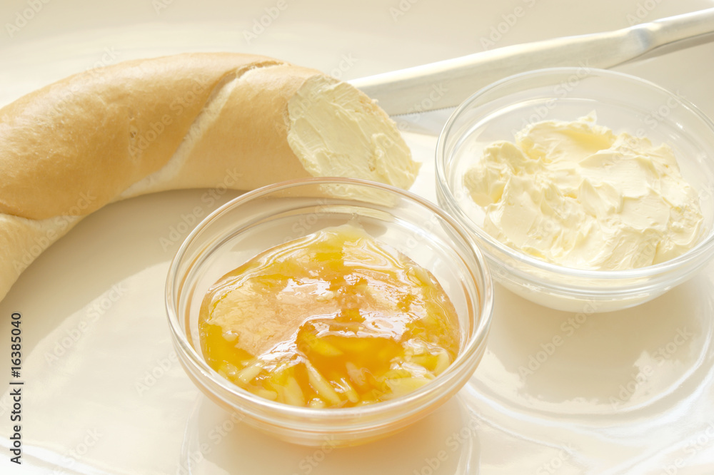 croissant with yellow plum jam, butter and knife croissant with yellow plum jam, butter and knife
