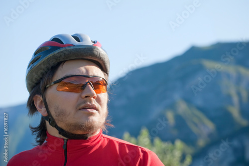 Portrait of a young cyclist in helmet