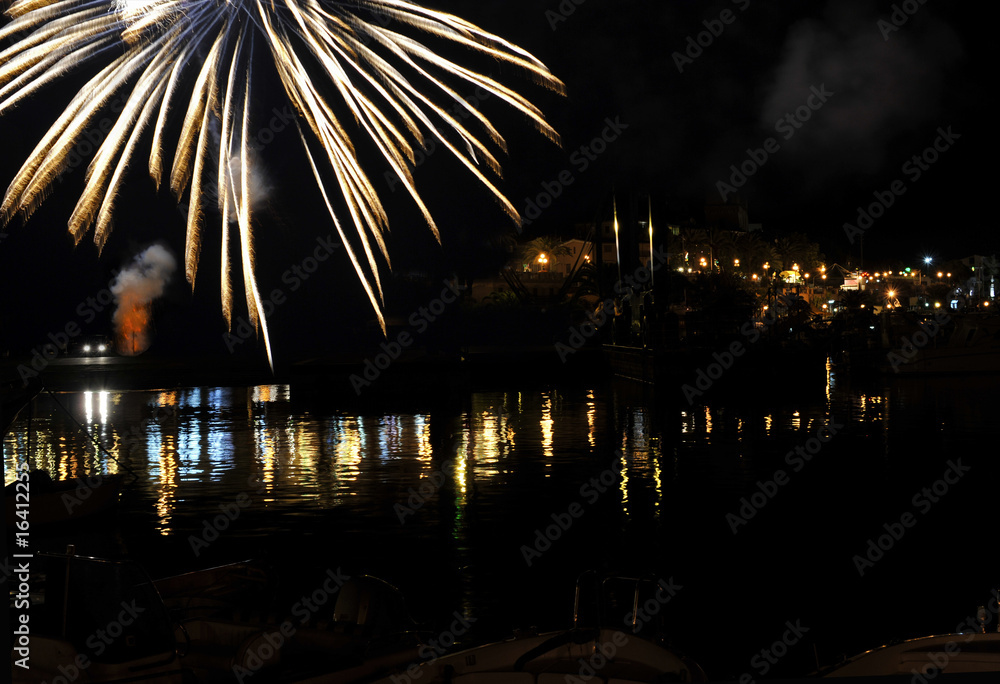 Fireworks over sea by night, Marina of Camerota, Italy