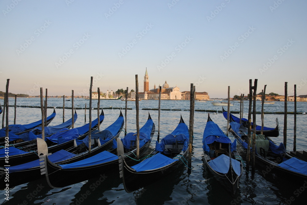Venice Gondolas lined up by pier