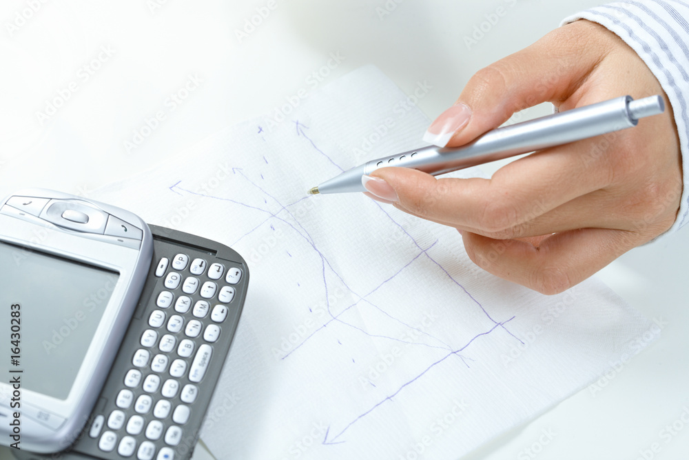 Female hand drawing graph