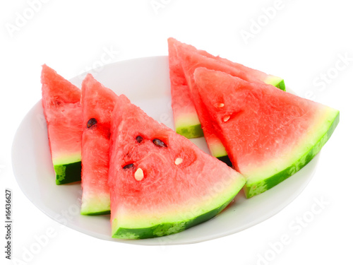 Slice of watermelon on white plate, isolated on white.