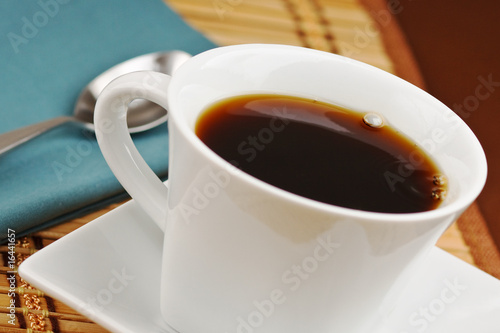 Freshly poured cup of hot black coffee