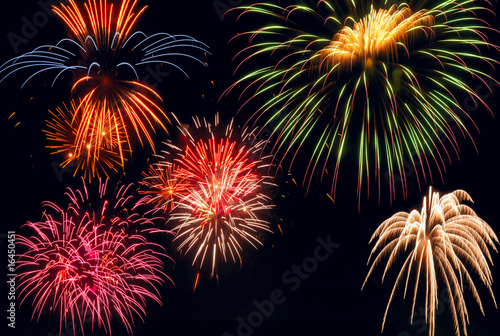Multiple bursts of brilliantly multicolored fireworks © Kenneth Sponsler