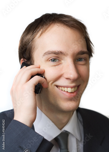 Young professional smiles while on the phone