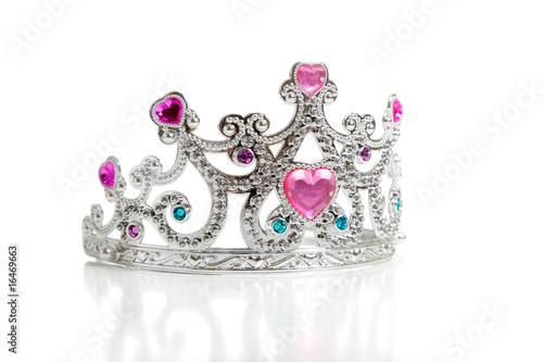 A child's toy princess tiara on a white background