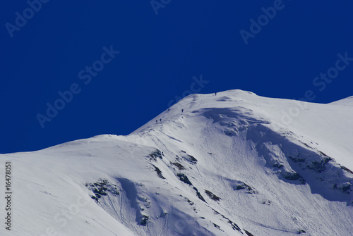 Skialpinists trekking high in mountains photo