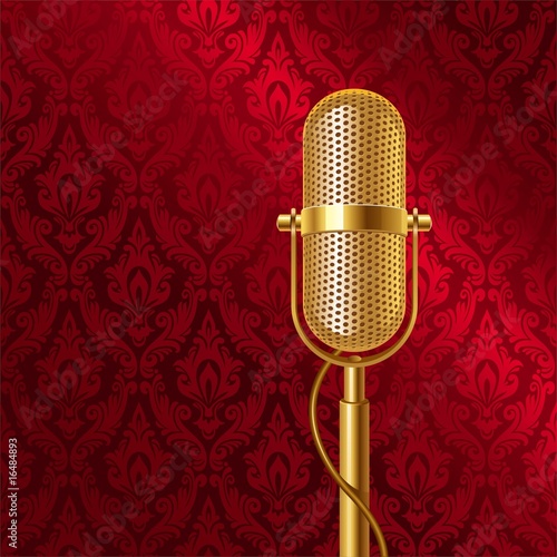 Golden retro microphone on a damask pattern background