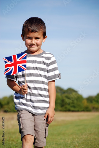 Young boy holding unionjack flag photo