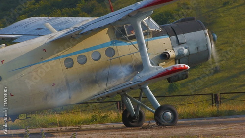 HD airplane with rotating propeller standing on concrete runway