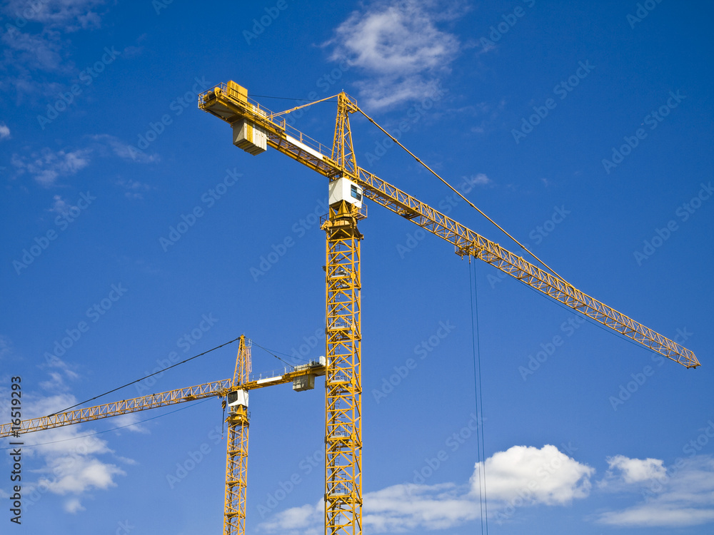 the building tower cranes at construction site the building tower cranes at construction site