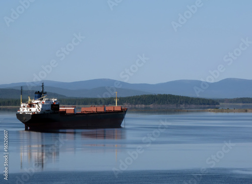 Fototapeta Cargo ship on the roadstead of Kandalaksha, Russia