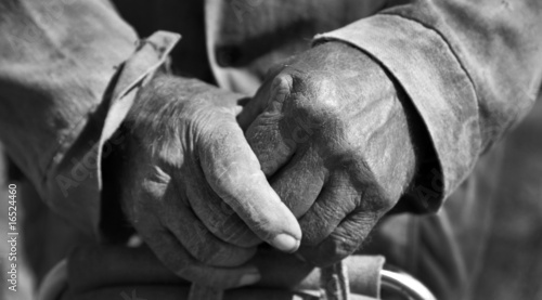 Closeup working farmer hands old