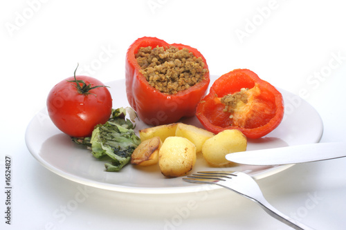 mince filled paprika with tomato on a plate