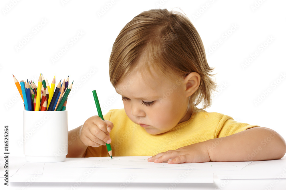 Child draw with green crayon Child draw with green crayon