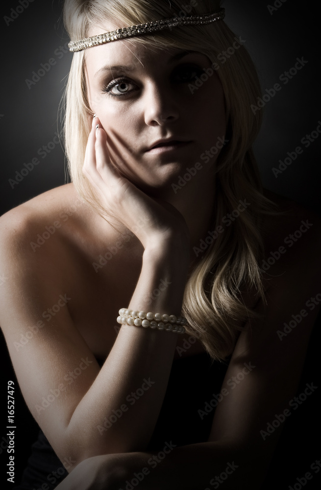 Low Key Shot of a Beautiful Blonde Teenage Girl Low Key Shot of a Beautiful Blonde Teenage Girl