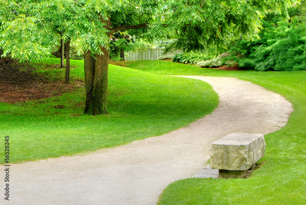 Stone bench on a gravel path