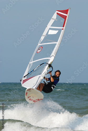 windsurf jumping over wawe 3