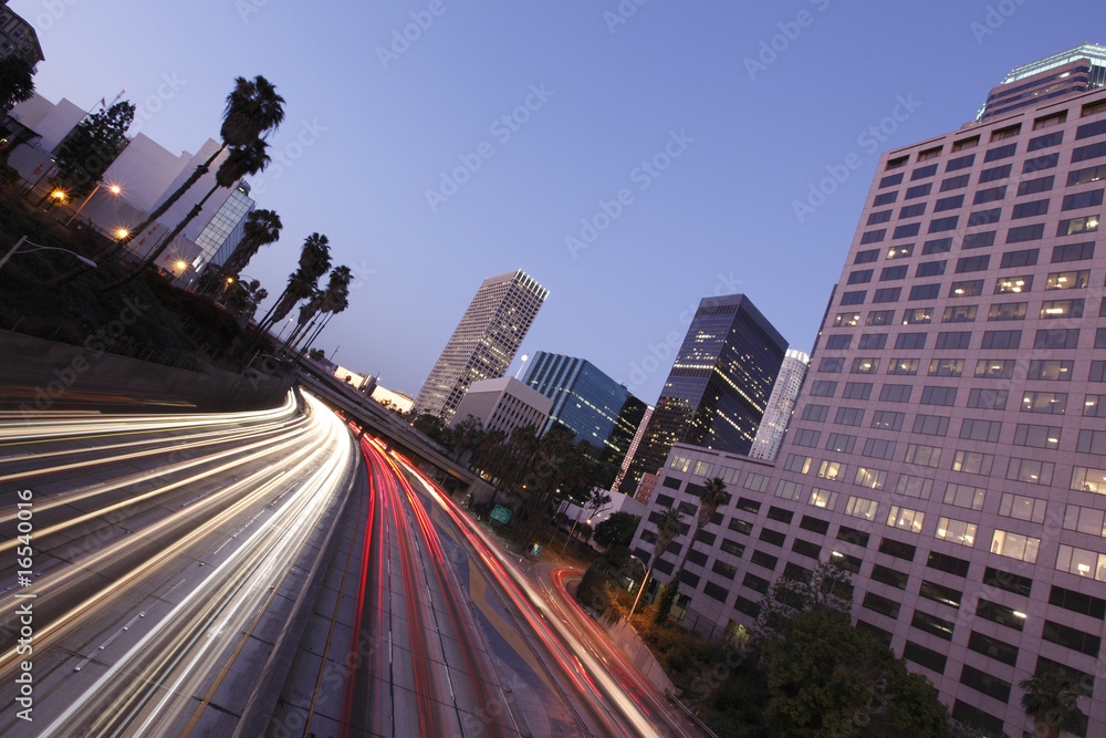 Los Angeles city skyline and freeway after sunset