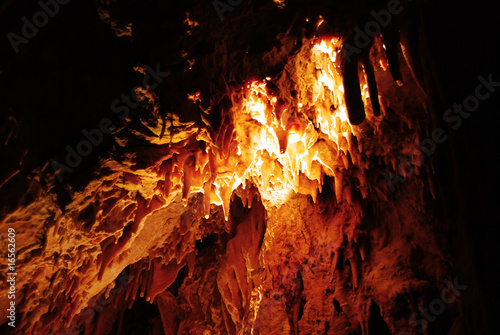 Stalagmites in stone cave photo