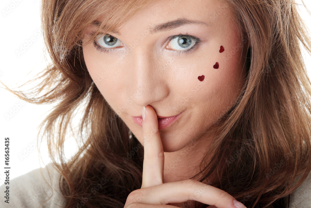 Young Woman Gesturing for Quiet or Shushing Young Woman Gesturing for Quiet or Shushing