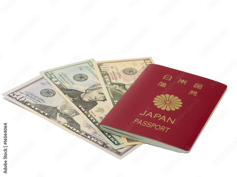 Japanese passport and dollar bill Japanese passport and dollar bill