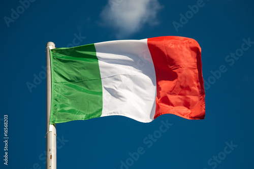 Fotografie Italian flag against blue sky