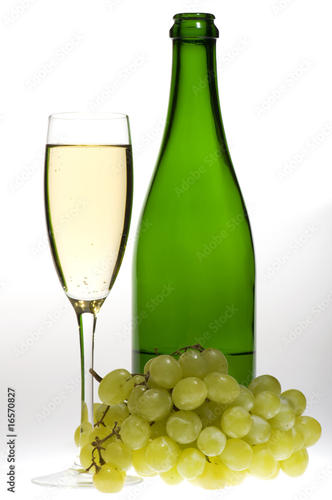 champagne glasses with grapes and bottle