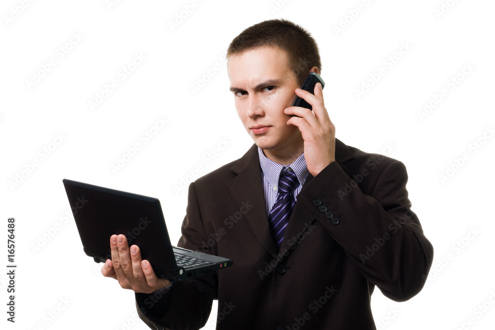 Young handsome man with cell phone and laptop Young handsome man with cell phone and laptop