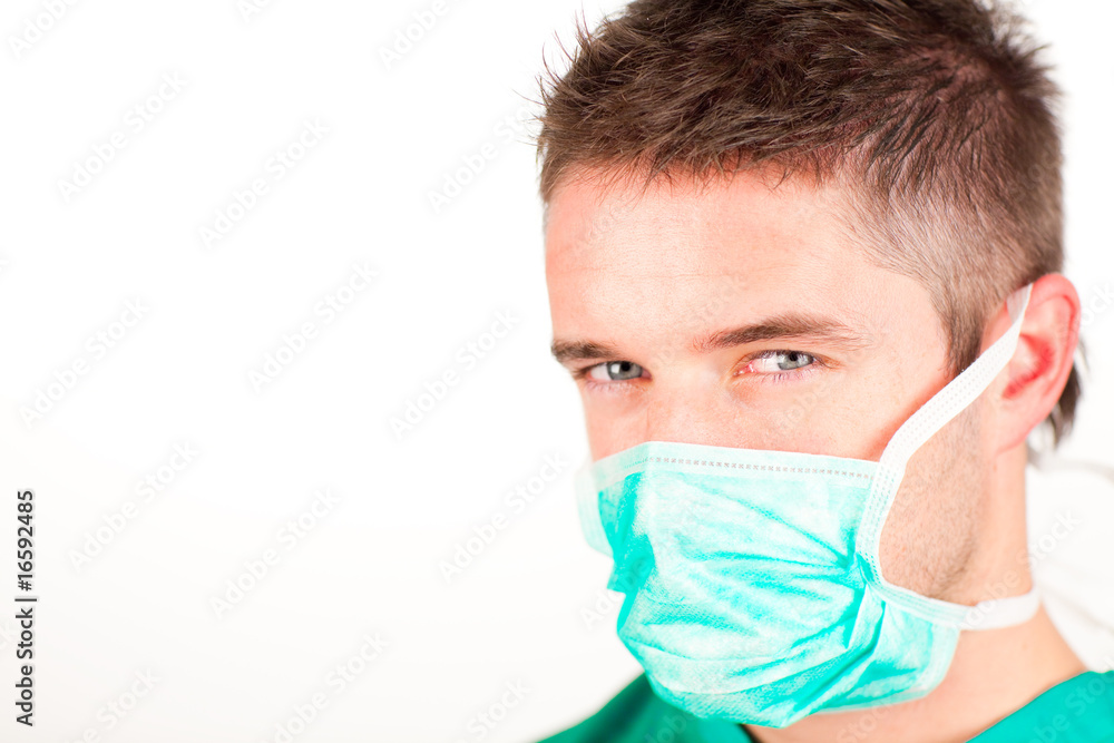 Attractive surgeon with mask looking at the camera Attractive surgeon with mask looking at the camera