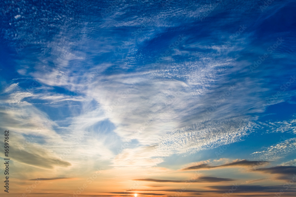 Naklejka premium photo of sunset sky with sun at buttom of the picture