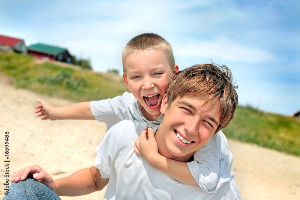 Fototapeta premium happy teenager and kid