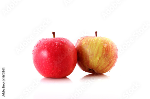 Red apple and yellow-green pear isolated on white background