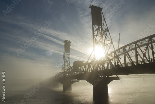 Hawthorne Bridge in Portland with fog and sun. photo