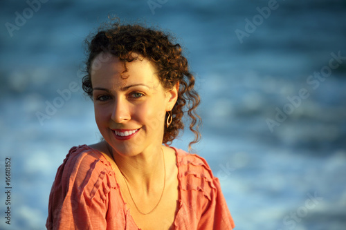 Portrait of young woman against sea © Pavel Losevsky