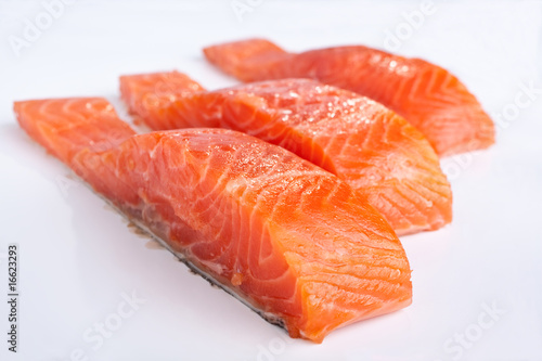 three salmon pieces on white background