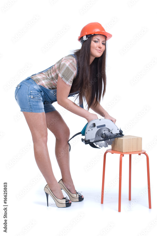 Young woman in orange helmet holding buzz saw Young woman in orange helmet holding buzz saw