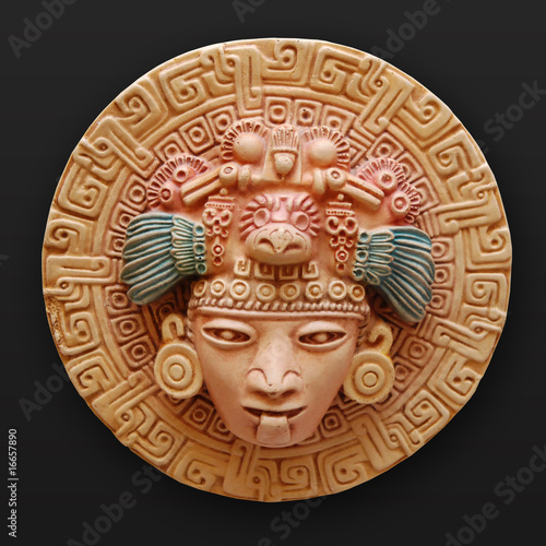 Stone bas-relief woman face round latin america