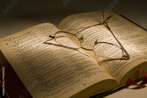 Reading Glasses Resting on a Bible