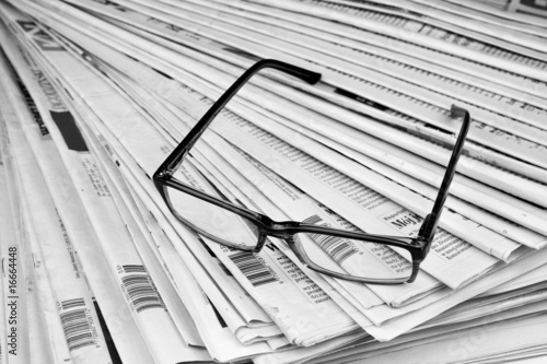Black and white newspaper and glasses