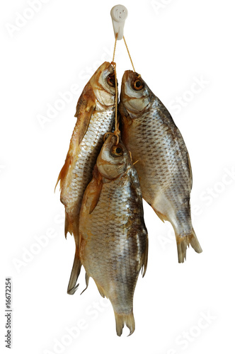 Three smoked sea roach fishes isolated on white