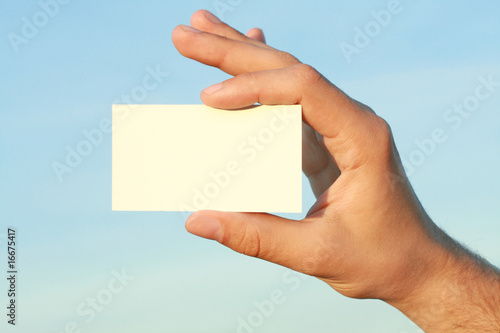 business card in a man's hand