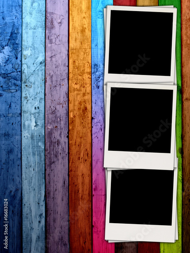 Canvastavla Three Blank Photos on Wood Background