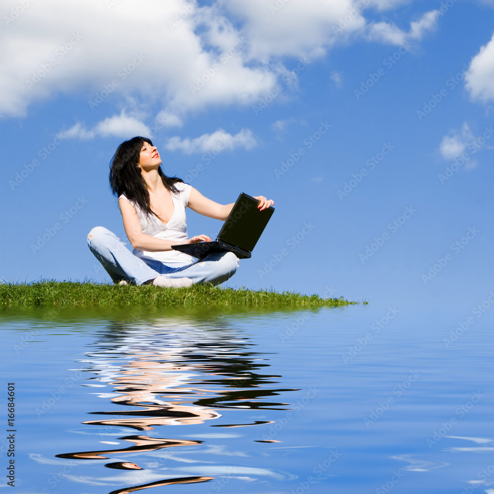 pretty woman with laptop on the green grass pretty woman with laptop on the green grass