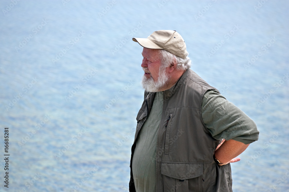 Senior man with water in background Senior man with water in background