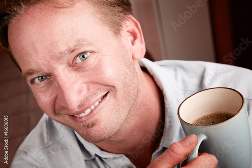 Handsome man with cup of coffee