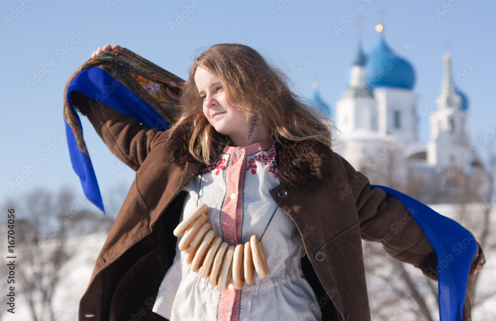 Smiling girl in russian traditional  clothes